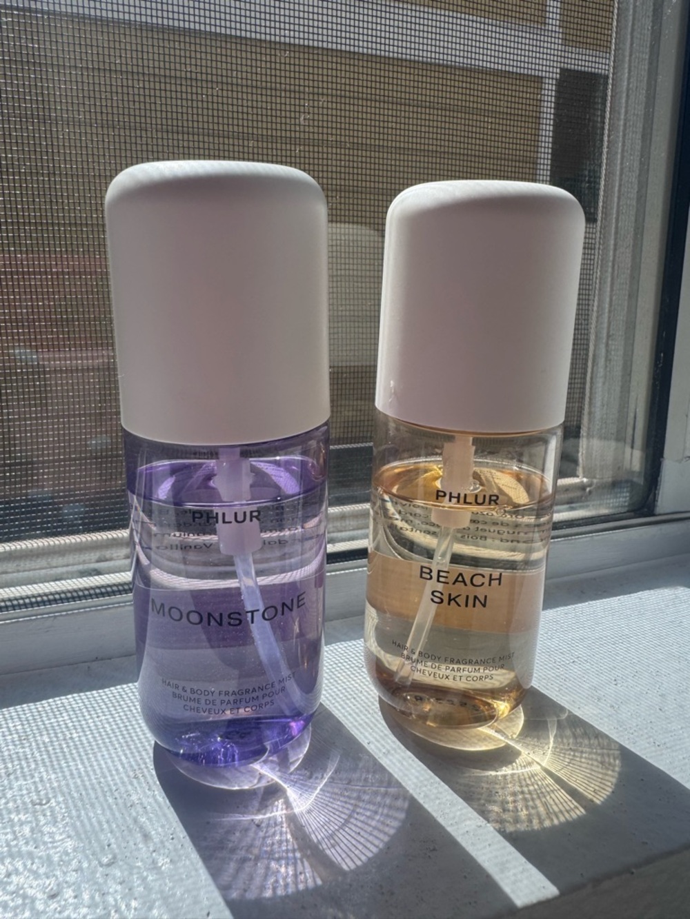 PHLUR Moonstone & Beach Skin Fragrance Mists — Purple & Amber